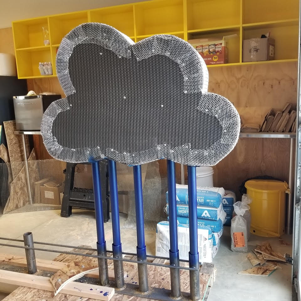 One of the clouds for the sign under construction